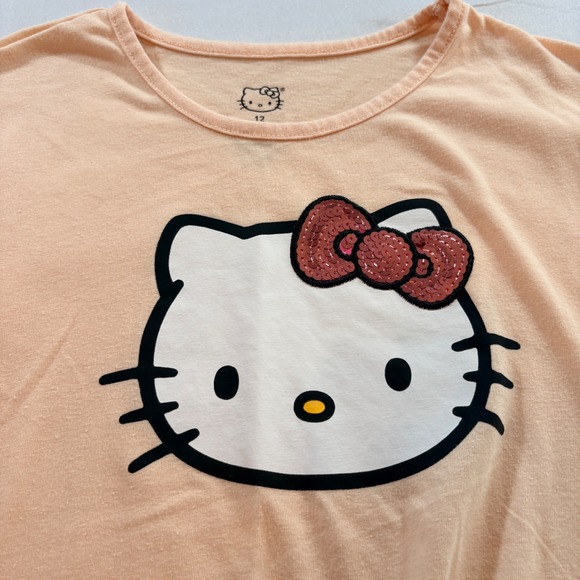 Hello Kitty by Sanrio Other - Hello Kitty Sanrio Graphic T-Shirt Girl 12 Peach Sequin Bow Front Tie Casual Tee